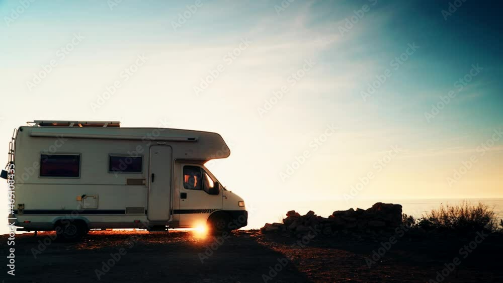 Camper rv camping on coast sea shore at sunrise. Adventure, travel with mobile home. Camper rv camping on coast sea shore at sunrise. Adventure, travel with mobile home.