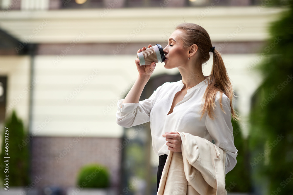 beautiful business woman going to work with coffee beautiful business woman going to work with coffee