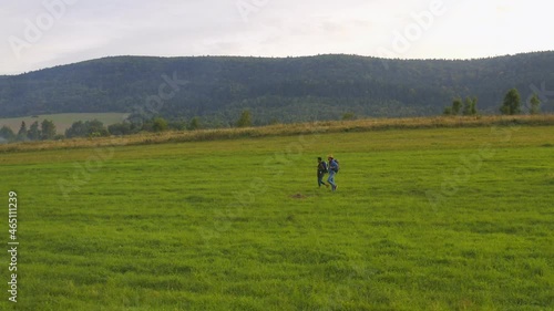 Wallpaper Mural Couple of multi-ethnic travelers hiking in grorious mountain nature. Family trip summer natural vacation destination to beautiful countryside. Relationship. Torontodigital.ca