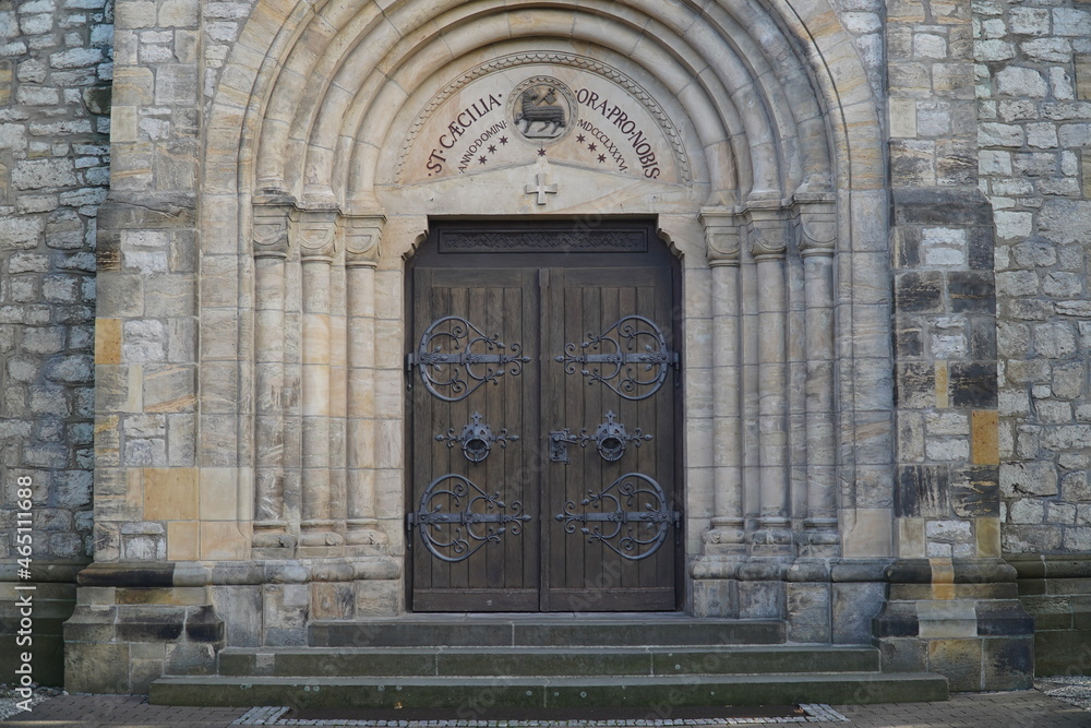 Entrance portal to the catholic parish church Saint Caecilia from 1886 in the municipality of Harsum, a village in the district of Hildesheim, in Lower Saxony, Germany.