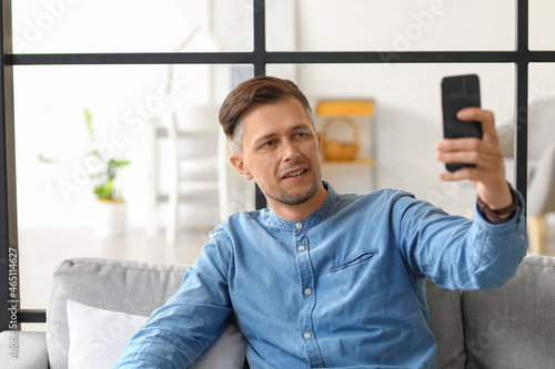 Handsome man taking selfie ...