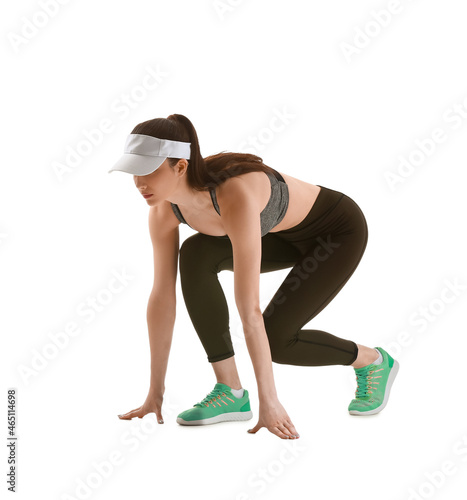 Sporty young woman in crouc...