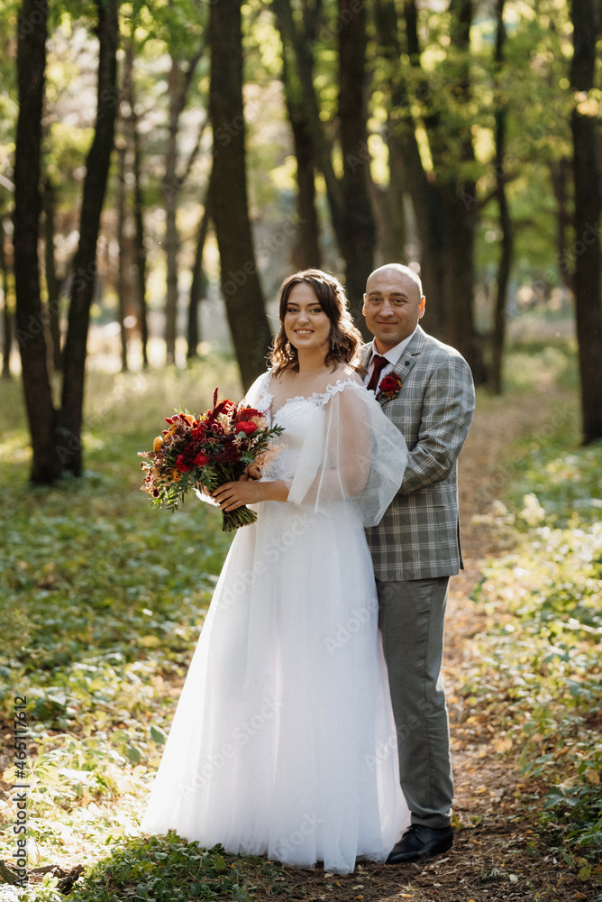 walk of the bride and groom through the autumn forest walk of the bride and groom through the autumn forest