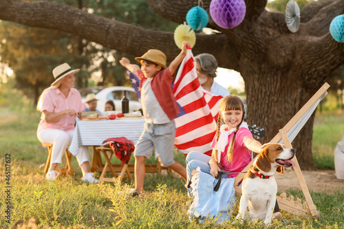 Canvas Print Happy family at barbecue party on summer day
