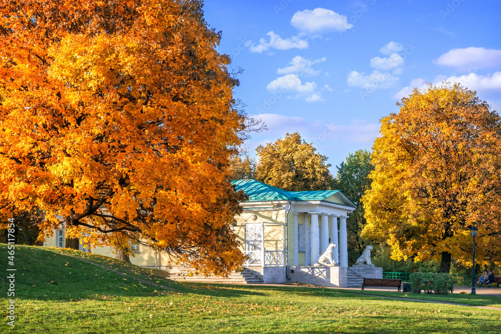 Golden autumn trees and the Pavilion with lions in the Kolomenskoye park in Moscow on an autumn sunny day Golden autumn trees and the Pavilion with lions in the Kolomenskoye park in Moscow on an autumn sunny day