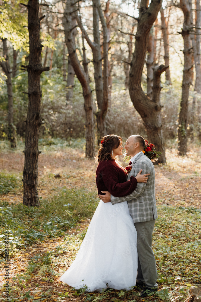 walk of the bride and groom through the autumn forest walk of the bride and groom through the autumn forest