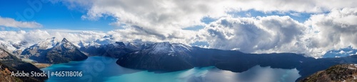 Panoramic landscape view of Garibaldi Lake. Sunny and cloudy Fall Day. Taken from top of Panorama Ridge, located near Whister and Squamish, North of Vancouver, BC, Canada.