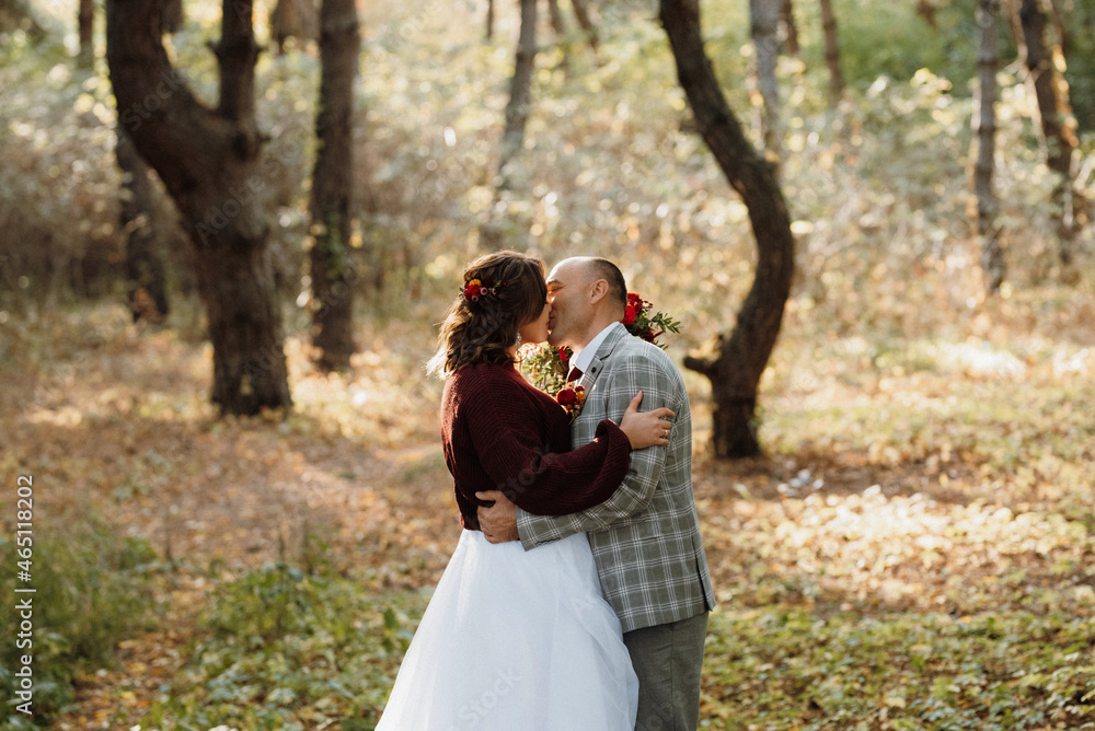 walk of the bride and groom through the autumn forest walk of the bride and groom through the autumn forest