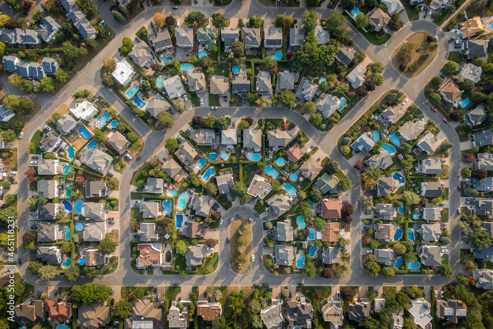 Fototapeta premium Top down aerial view of houses and streets in beautiful residential neighbourhood in Montreal, Quebec, Canada. Property, homes and real estate concept.