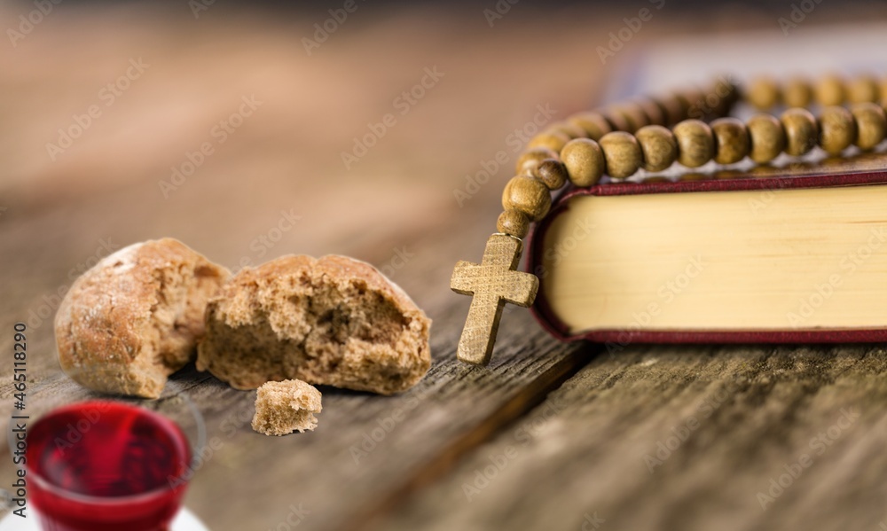 Taking communion concept - the wine and the bread with Holy Bible. Taking communion concept - the wine and the bread with Holy Bible.