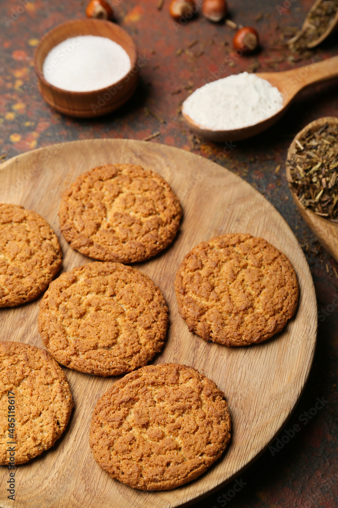 Plate with tasty hojicha cookies on grunge background Plate with tasty hojicha cookies on grunge background