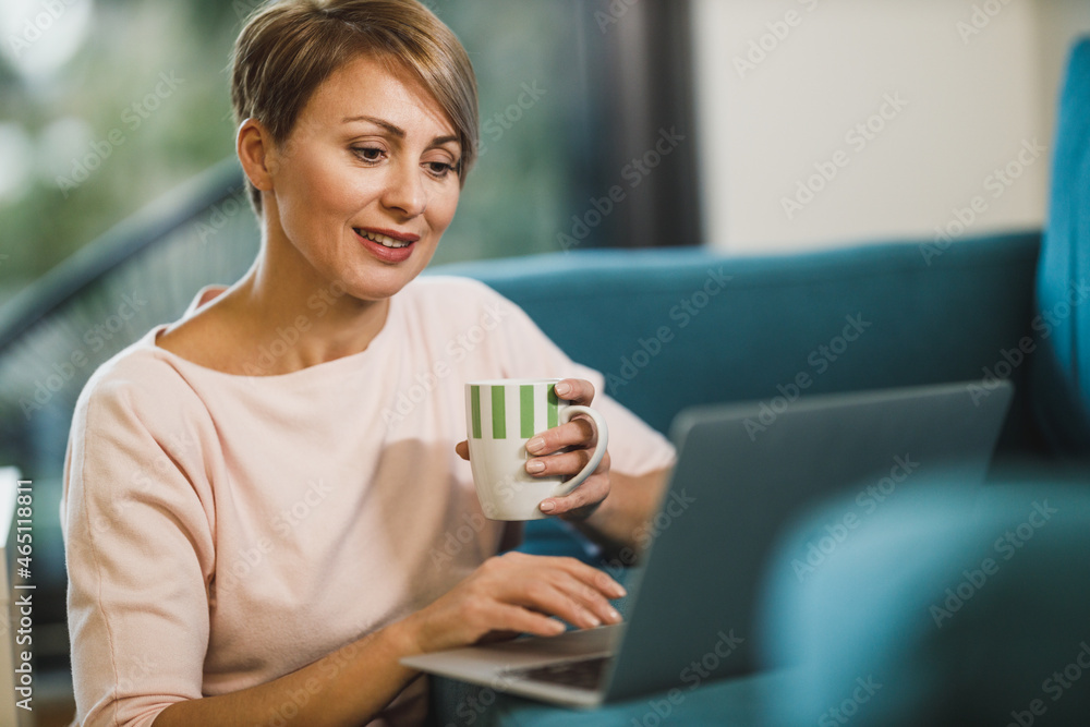 Woman Using Laptop While Working From Home Woman Using Laptop While Working From Home