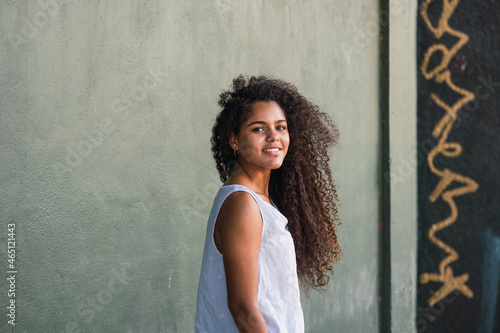 Photos Portrait of a teenage cuban woman girl from the back turning her face to the cam