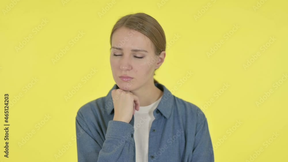 Young Woman Taking Nap on Yellow Background Young Woman Taking Nap on Yellow Background