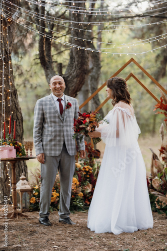 man and woman got engaged in autumn forest