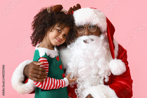 Cute little elf with Santa ...