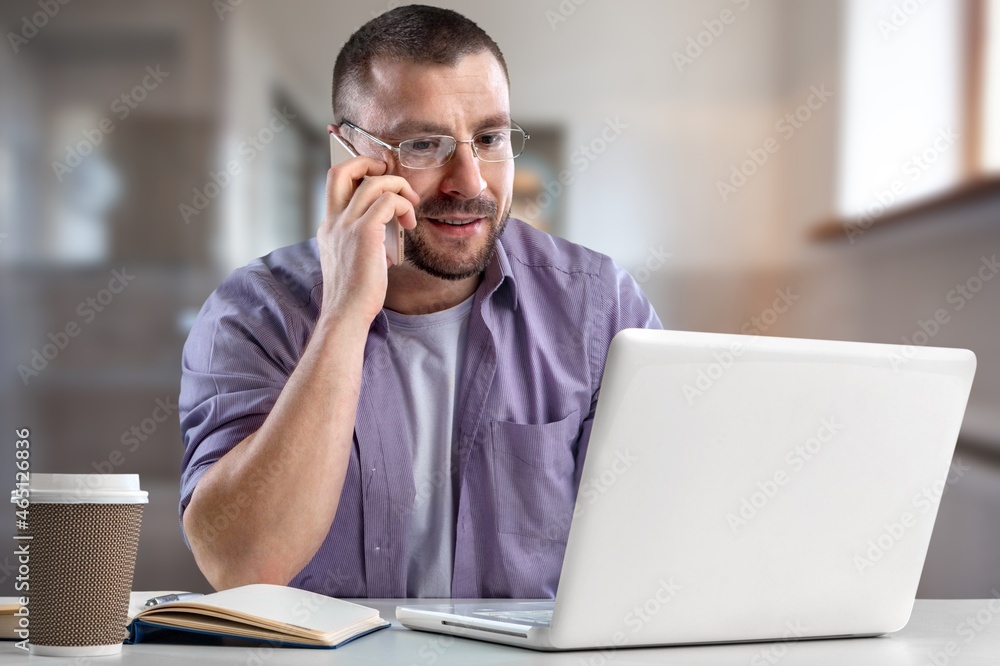 Mature business man using laptop computer having video conference call Mature business man using laptop computer having video conference call