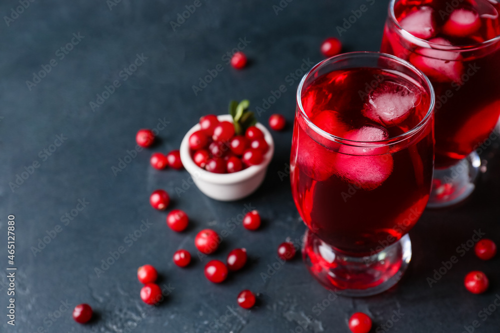 Glasses of cold lingonberry tea on dark background, closeup Glasses of cold lingonberry tea on dark background, closeup