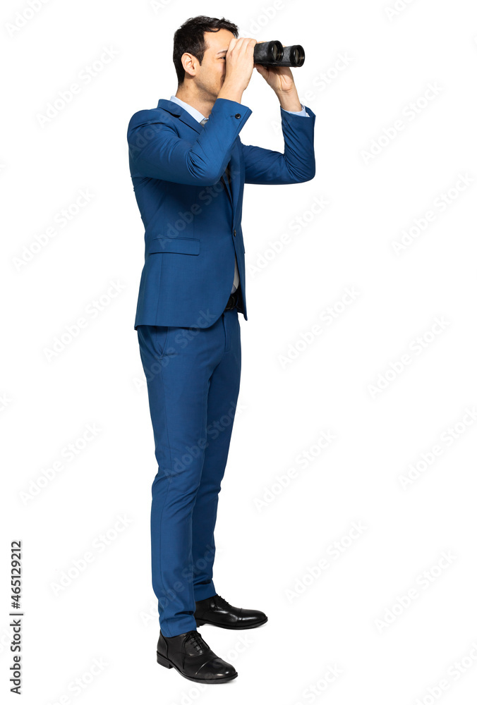 Businessman looking through binoculars isolated on white Businessman looking through binoculars isolated on white