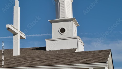Steeple in the sky behind pine tree 4K