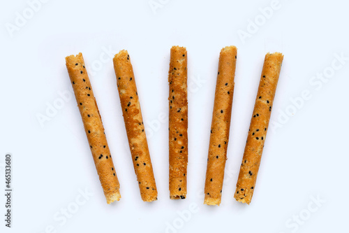 Crispy egg rolls on white background.