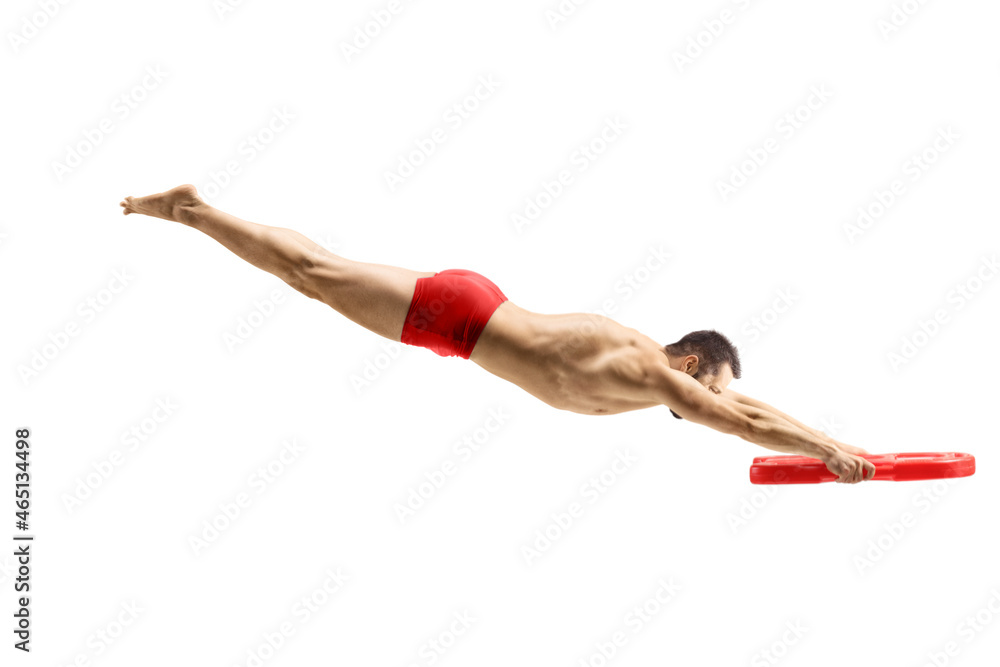 Male swimmer jumping and holding a swimming float