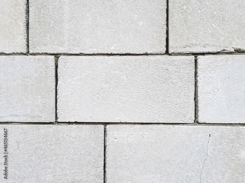 A background of white large, rough and cracked blocks that are reinforced with cement at the seams, an excellent close-up background