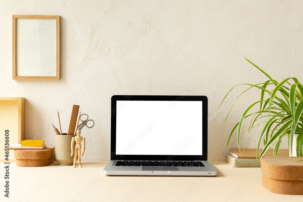 Laptop with blank screen on a table. Laptop with blank screen on a table.