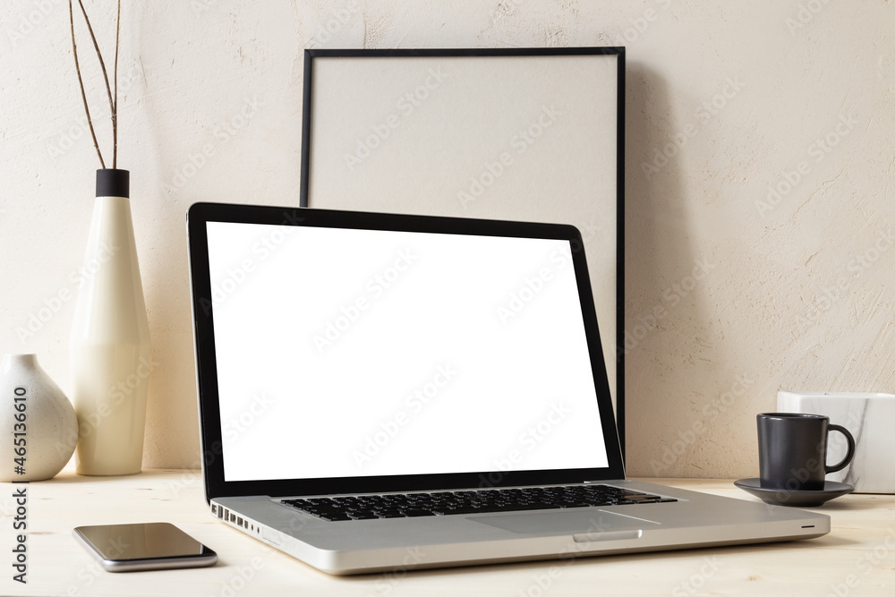 Stylish desk with laptop mock up. Minimal workspace desk of designer at home.
Stylish desk with laptop mock up. Minimal workspace desk of designer at home.