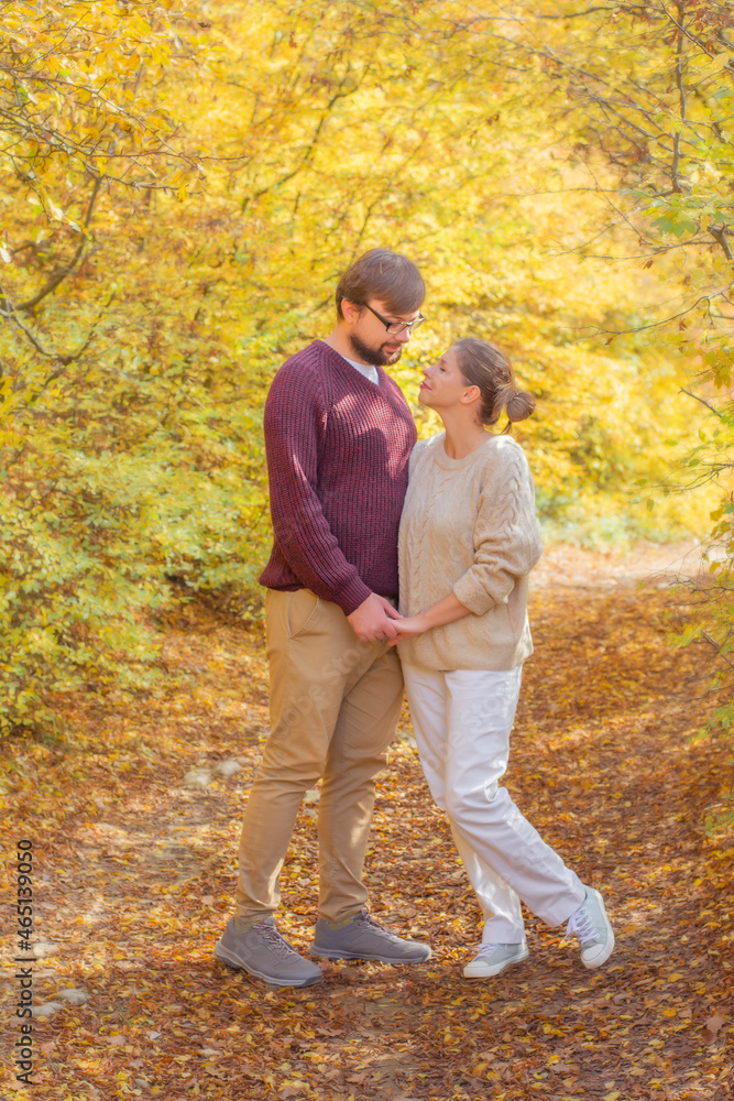 Happy couple in love traveling in autumn adventure outdoor copy space