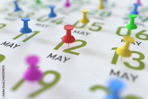 May 12 date marked with red pushpin on a calendar, 3D rendering