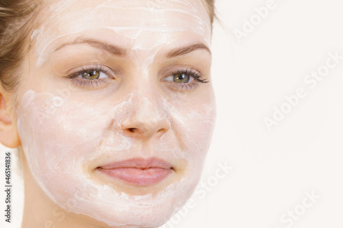 Girl with cream moisture cosmetic on face