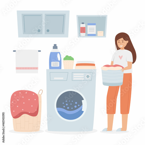 Happy woman doing laundry at home