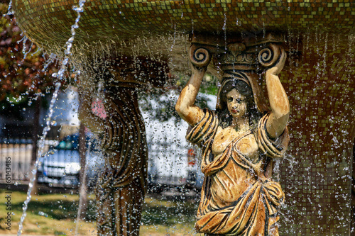 City fountain in the park in very hot summer weather. Background with copy space for text photo