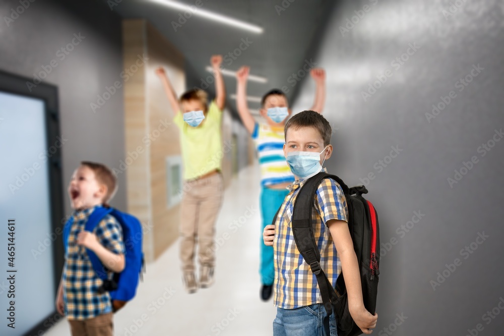 Fototapeta premium Group of cheerful children going home from school after quarantine and lockdown.