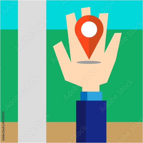 手の上のマップピンと街