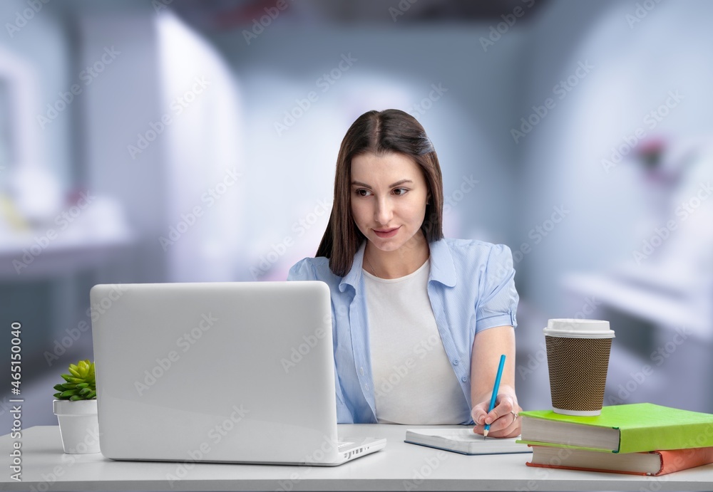 Thoughtful female studying working from home Thoughtful female studying working from home