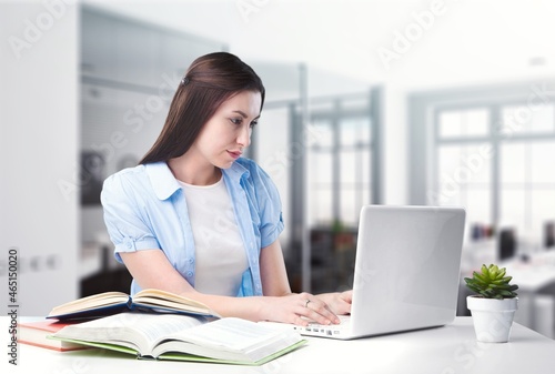 Thoughtful female studying working from home