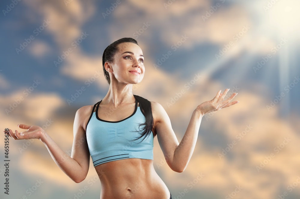 Portrait of fit woman smiling with perfect body relaxing after gym training Portrait of fit woman smiling with perfect body relaxing after gym training