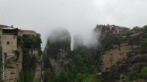 Meteora, Greece, Aerial View of Iconic Monasteries on Steep Cliff Under Morning Fog. Unesco World Heritage Site, Drone Shot