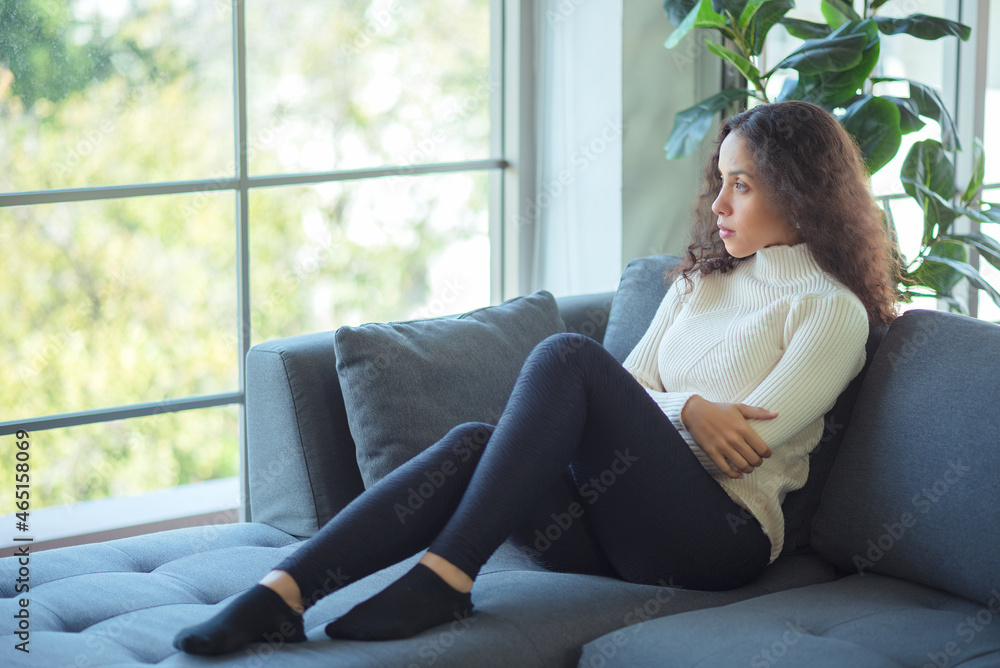 Lifestyle relaxes happy Latin woman relaxing on the sofa at home. Lifestyle relaxes happy Latin woman relaxing on the sofa at home.