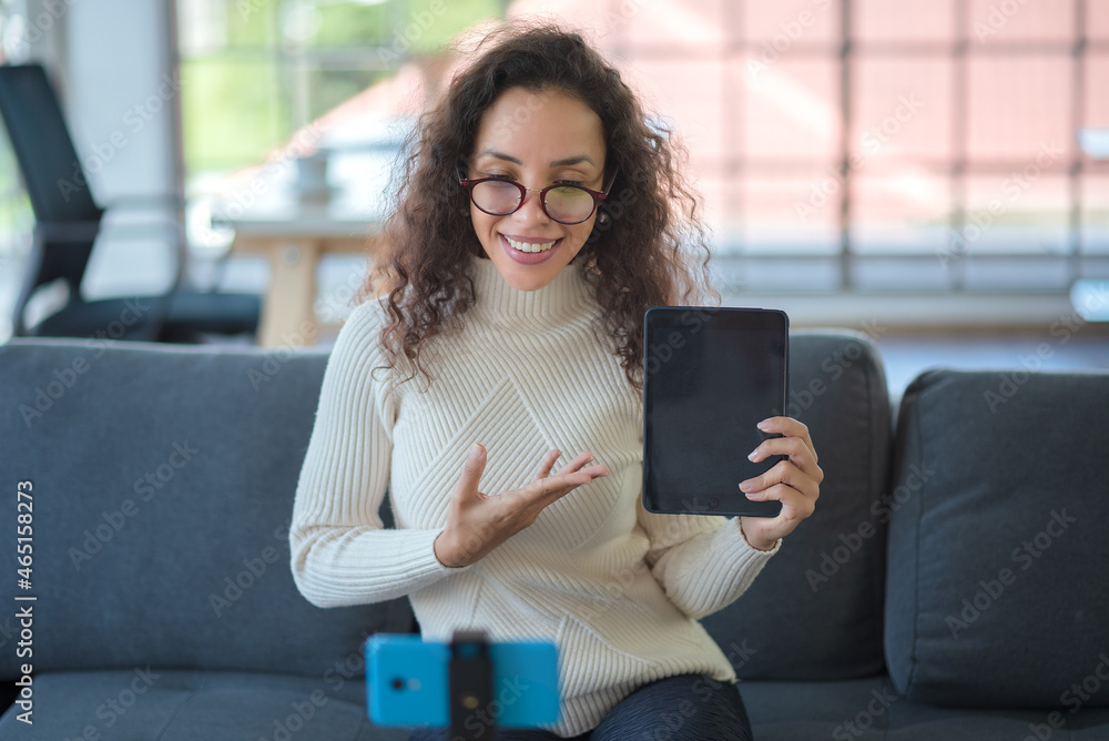 Latino woman facetime with smartphone Works remotely, Social Distancing, New Normal concept.