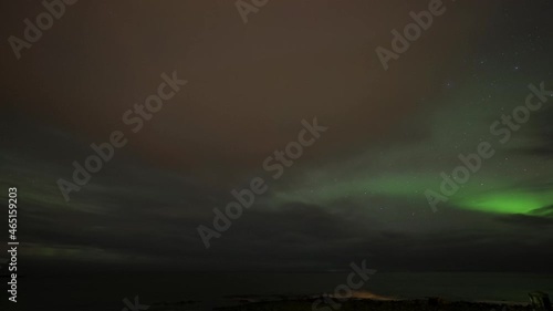 Wallpaper Mural Timelapse of aurora borealis lighting up starry sky and low clouds in Iceland. Torontodigital.ca