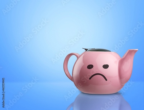 Blue Monday tea with a sad face on the big teapot