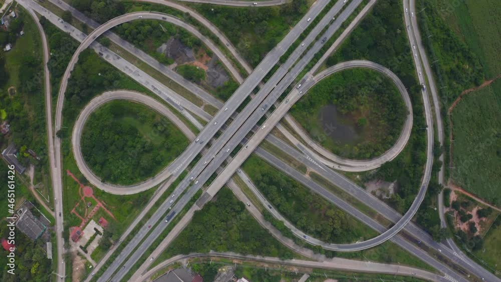 Aerial view of highway junctions with roundabout. Bridge roads shape circle in structure of architecture and transportation concept. Top view. Urban city, Bangkok at sunset, Thailand Aerial view of highway junctions with roundabout. Bridge roads shape circle in structure of architecture and transportation concept. Top view. Urban city, Bangkok at sunset, Thailand