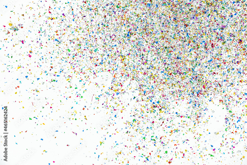 Small fragments of colorful paper pieces spill out in air as beautiful celebration flakes and vivid flares to entertain and decorate party Small fragments of colorful paper pieces spill out in air as beautiful celebration flakes and vivid flares to entertain and decorate party