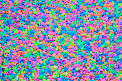Colorful neon pebbles closeup for background © neosiam
