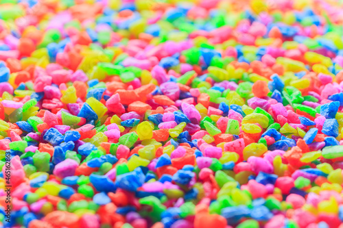 Colorful neon pebbles closeup for background
