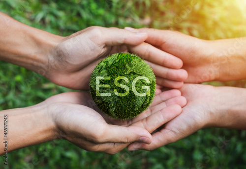Future environmental conservation and sustainable ESG. Hands adult Teamwork harmony Holding earth on hands. Environmental and reduce global warming help earth.