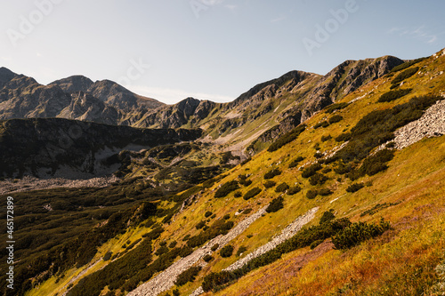 Hiking to salatin and brestova peak from zuberec. Western Tatras mountains, Rohace Slovakia. Hiker with backpack rises to the mountains. Slovakia mountains landscape. photo